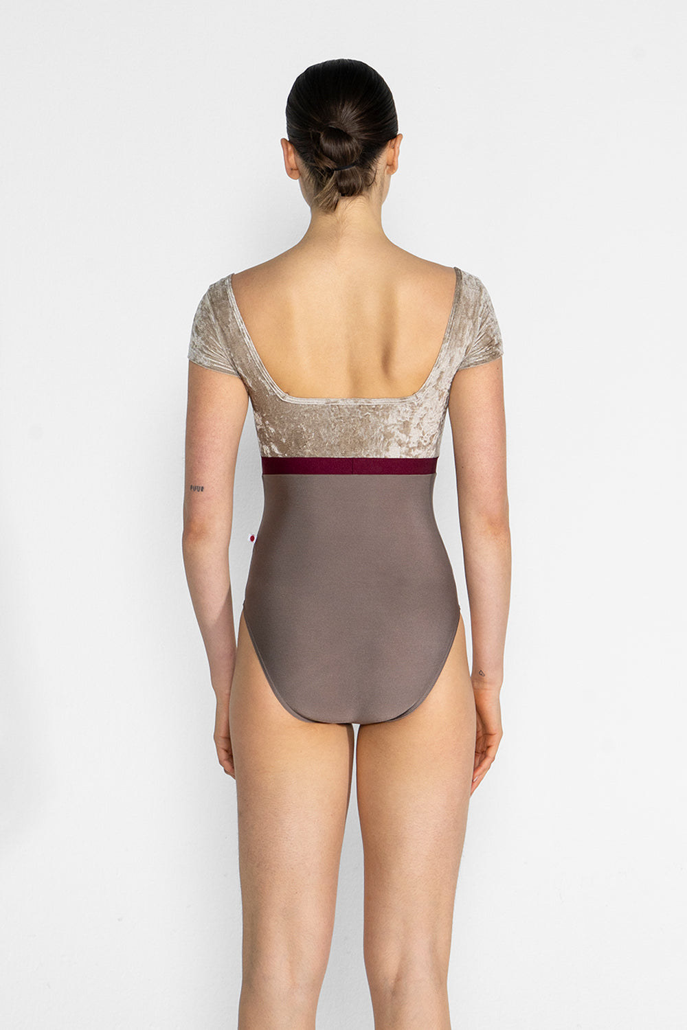 Marieke Variation 1 leotard in N-Star body color with CV-Toffee top & trim color and N-Burgundy middle band color. CV-Toffee short sleeves