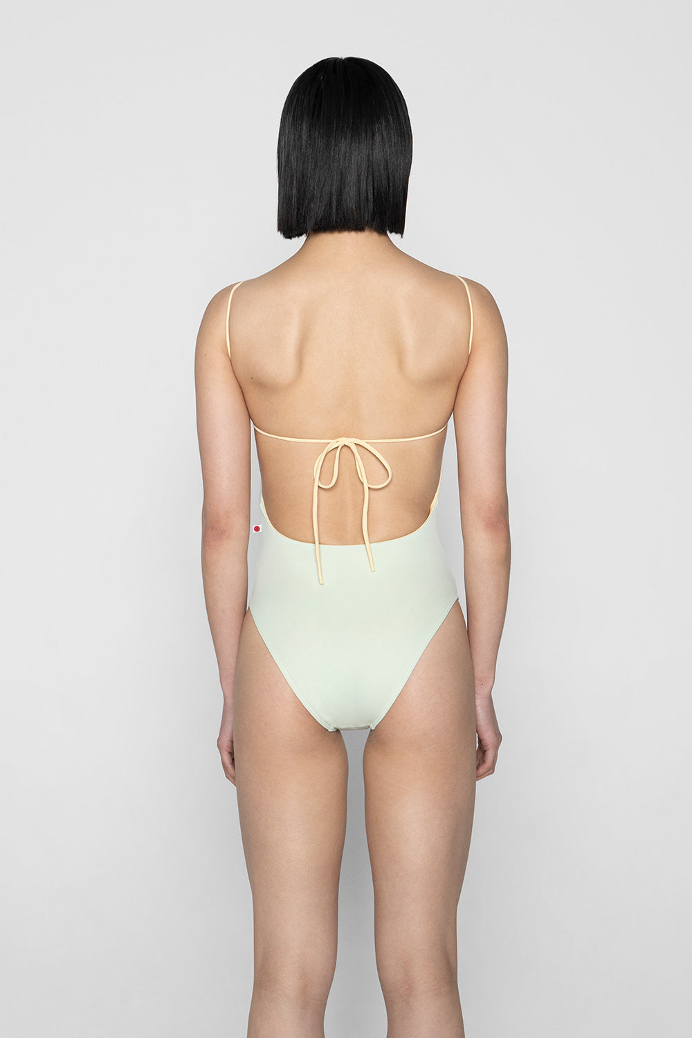 Romy leotard in T-Pistachio body color with T-Vanilla trim & inner lining color