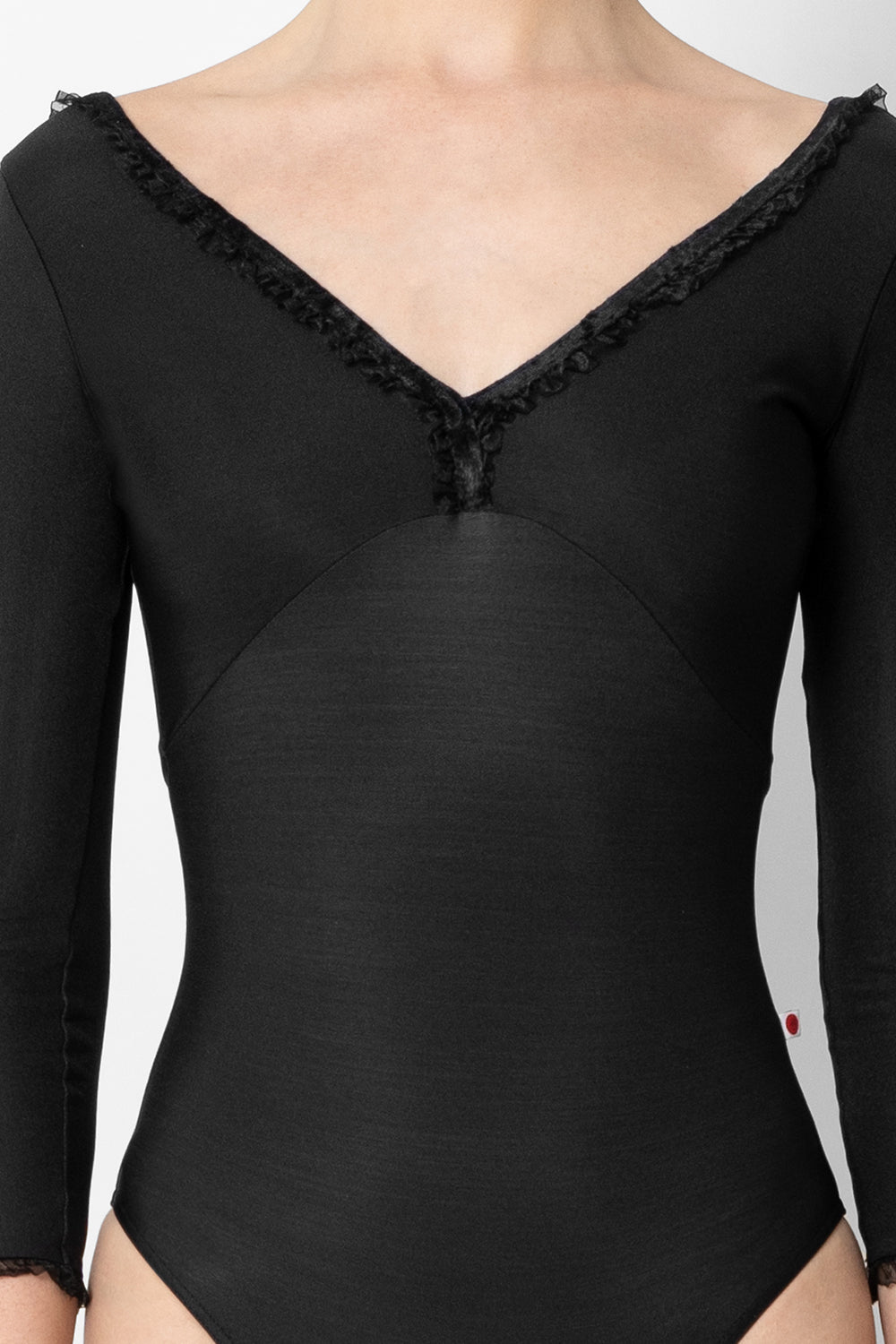 Alicia leotard in N-Black body & top color with CV-Black trim color, 3Q sleeves and Black Ruffle