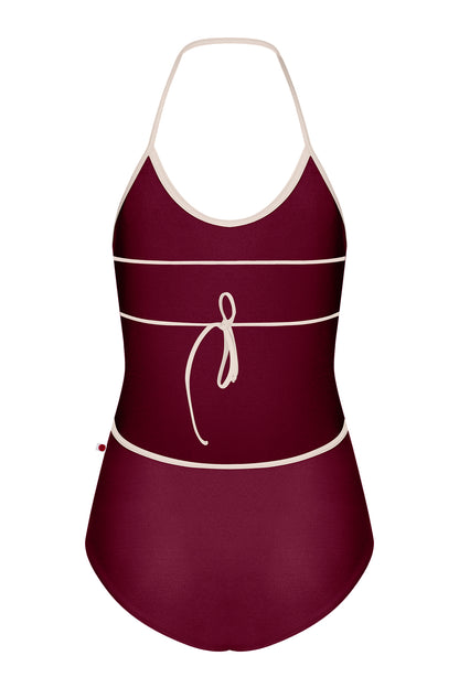 Kate leotard, deep-burgundy with a cream-trimmed halter neckline and open back.
