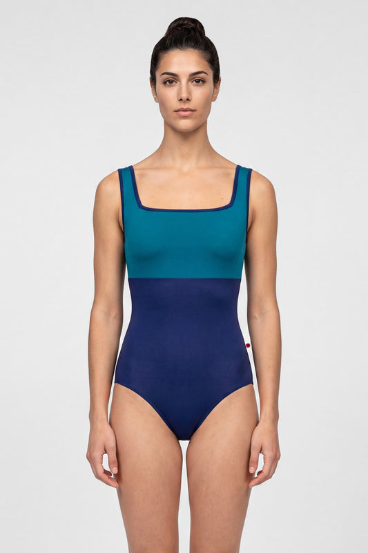 AI-generated model. Marieke leotard, teal square-neck bodice and a navy body with navy trim.