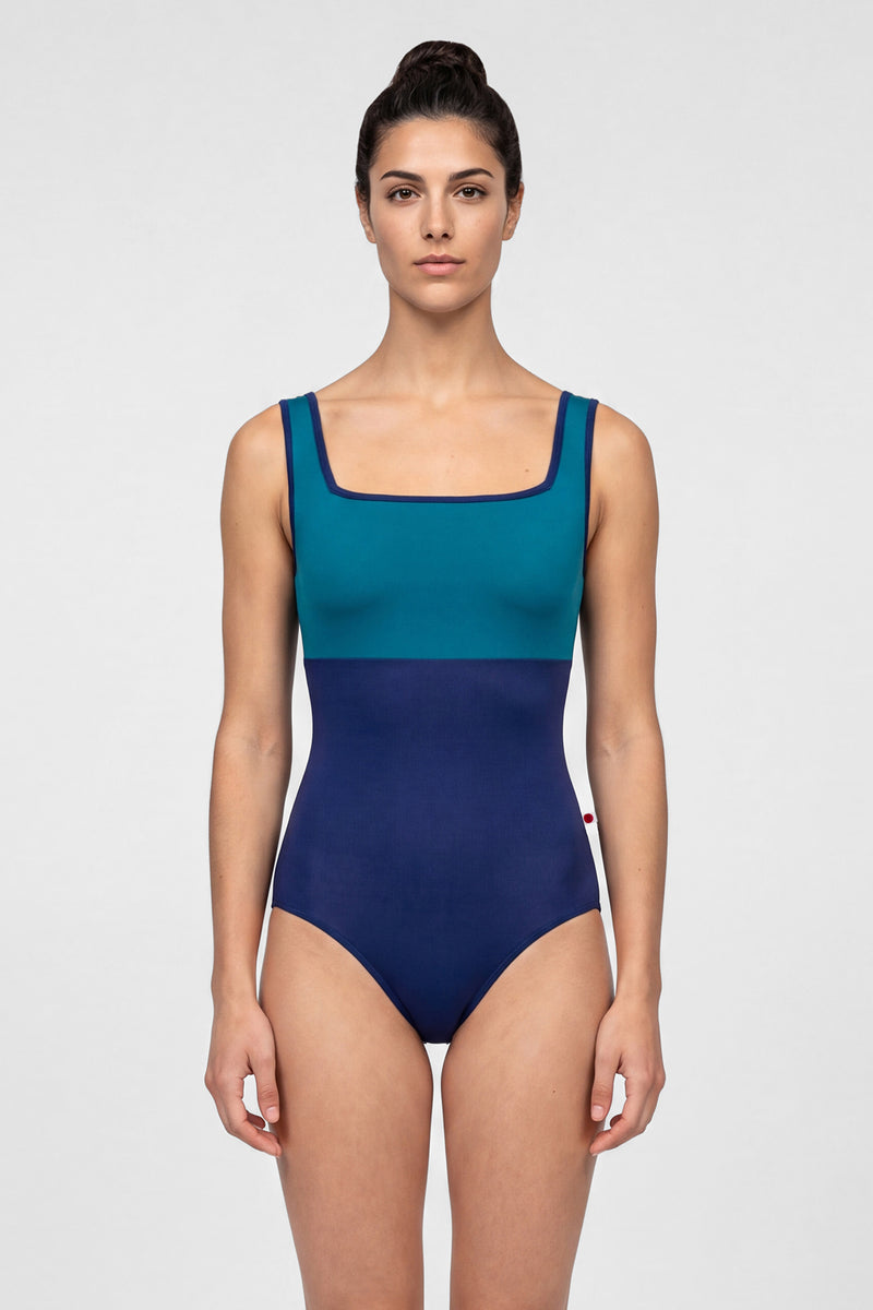 AI-generated model. Marieke leotard, teal square-neck bodice and a navy body with navy trim.