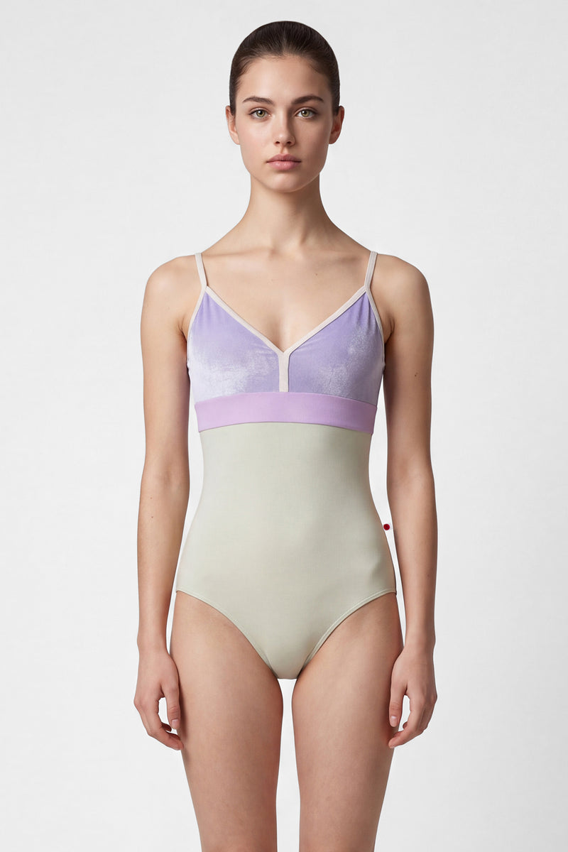AI-generated model. Zoe leotard, lilac velvet V-neck bodice with a pistachio body and lilac waistband, thin cream straps.