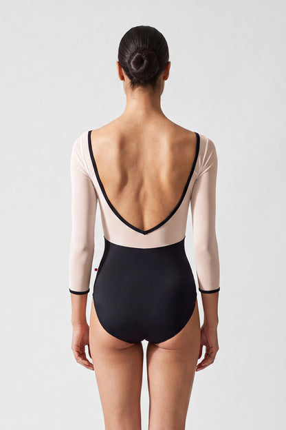 AI-generated model. Elli Mesh leotard, black T-Lunares polka-dot ruched bust with white mesh three-quarter sleeves and V-neck, black body.