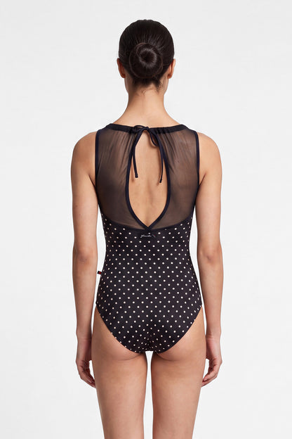 AI-generated model. Paris leotard, black T-Lunares polka-dot with a sheer black mesh boat neck and open back.