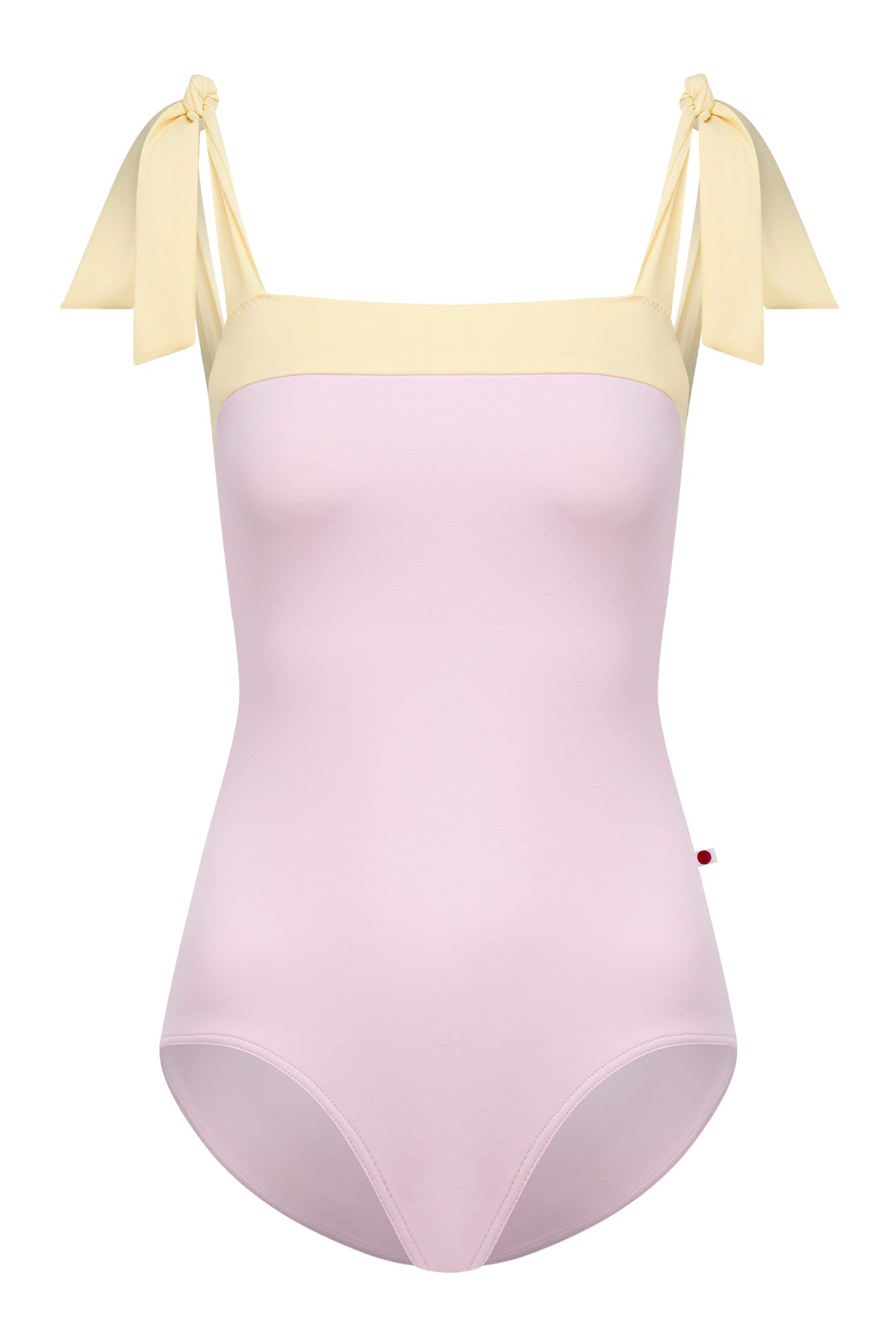 Mimi leotard, dusty pink body with a pale-yellow top band and knotted tie shoulder straps, square neckline.