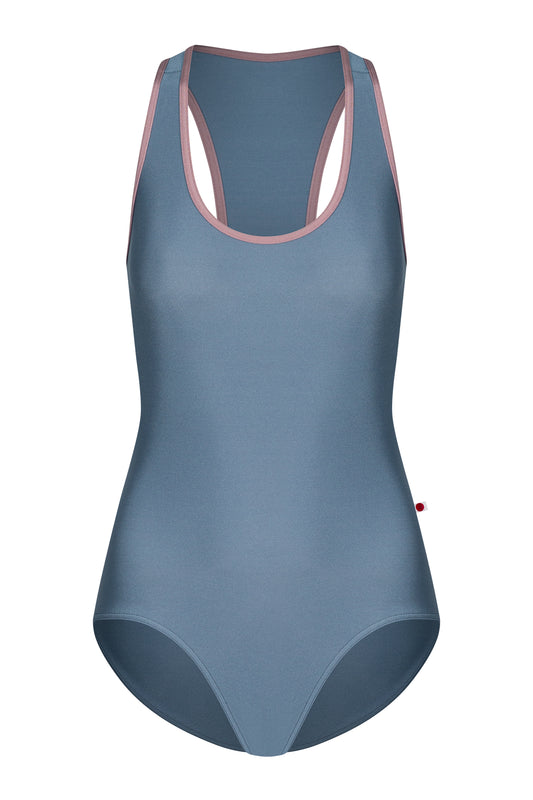 AI-generated model. Alex leotard, slate-blue with a scoop neckline and dusty-pink trim, racerback straps.
