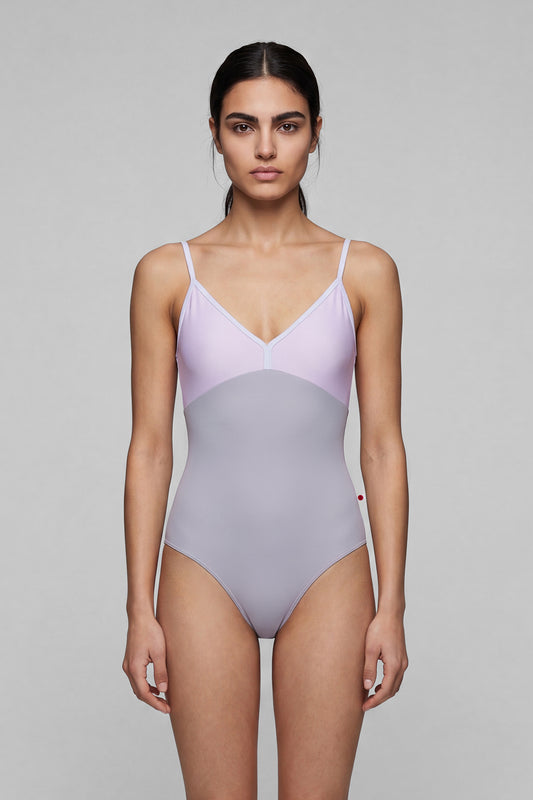 AI-generated model. Daria leotard, lilac bodice and a grey body with a V-neckline and thin straps.