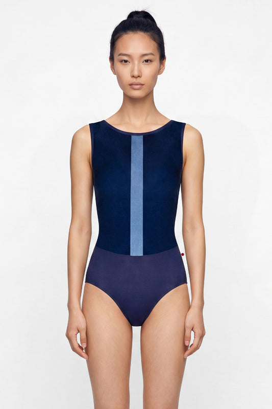 AI-generated model. Didi leotard, navy with a pale-blue vertical centre stripe and a high boat neckline.