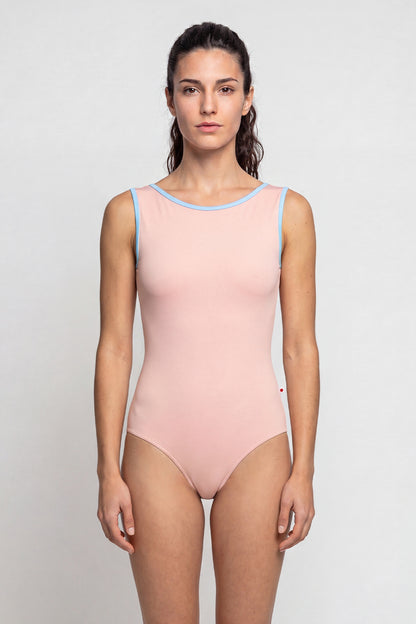 AI-generated model. Sofiane leotard, blush-pink with a contrasting pale-blue neckline trim.